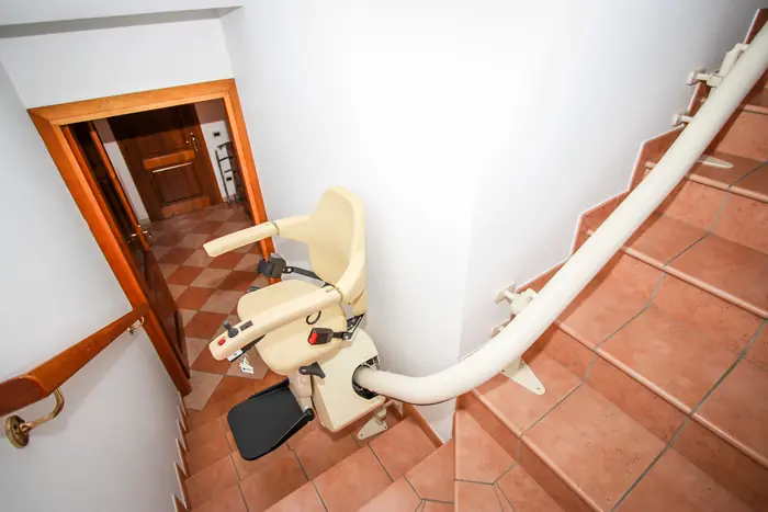 Curved stairlift: tiled steps and a landing