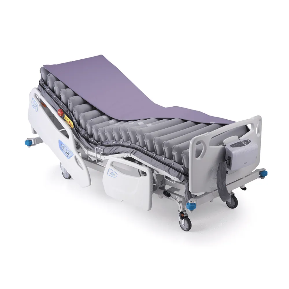 Illustrative powered air mattress and pump shown on an adjustable hospital bed frame
