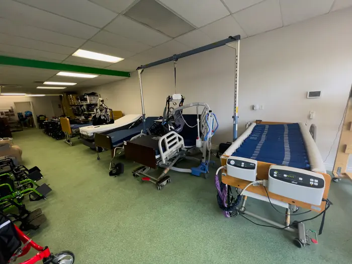 Beds, lifts and chairs on display in a Mobility Specialties showroom