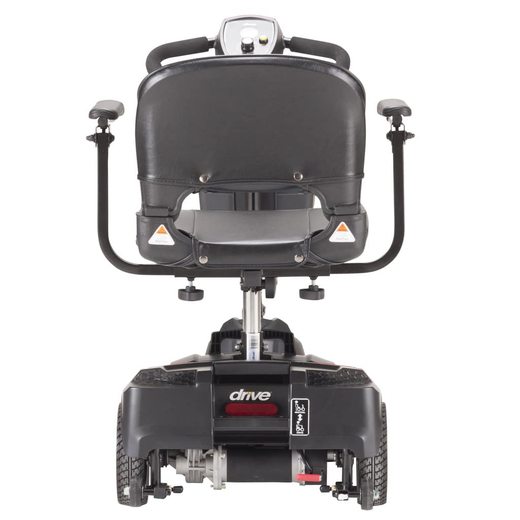 Rear view of the Drive Scout travel scooter showing the two rear wheels, motor and anti-tip wheels