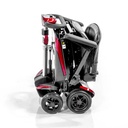 Red Transformer folded, side view, with the seat tucked over the wheels