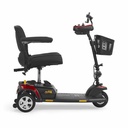 Opposite side view of the red Buzzaround XL with the tiller upright and seat facing forward