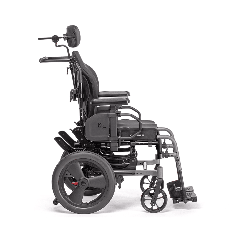 Side view of the CR45 sitting upright, with the curved tilt frames below the seat and the footrest hanger in front
