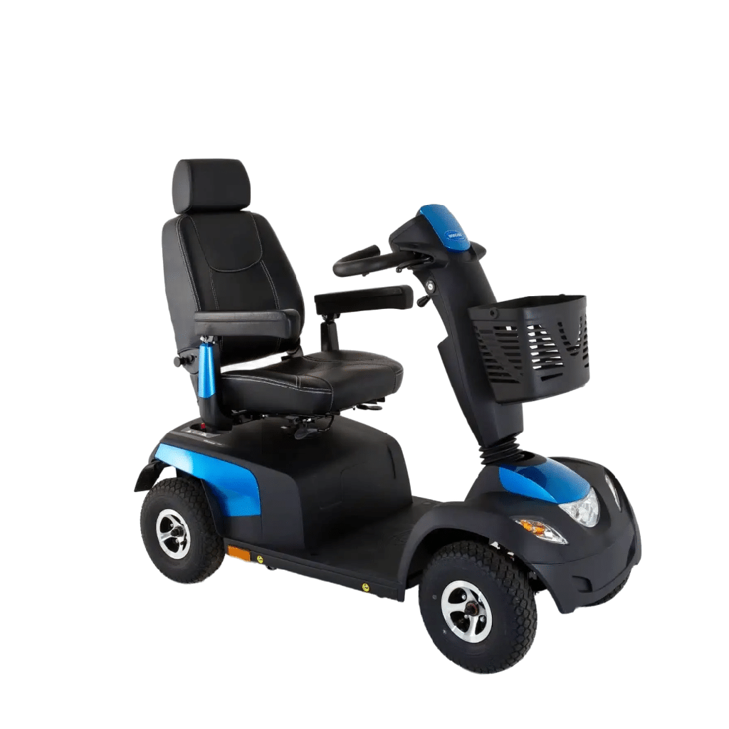 Invacare Comet Pro in blue from the front left, with the front basket and headrest