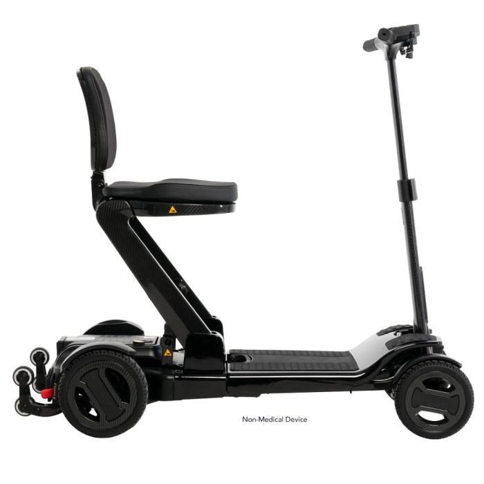 Right side of the Go-Go Carbon unfolded, showing the seat, the low deck and the tiller