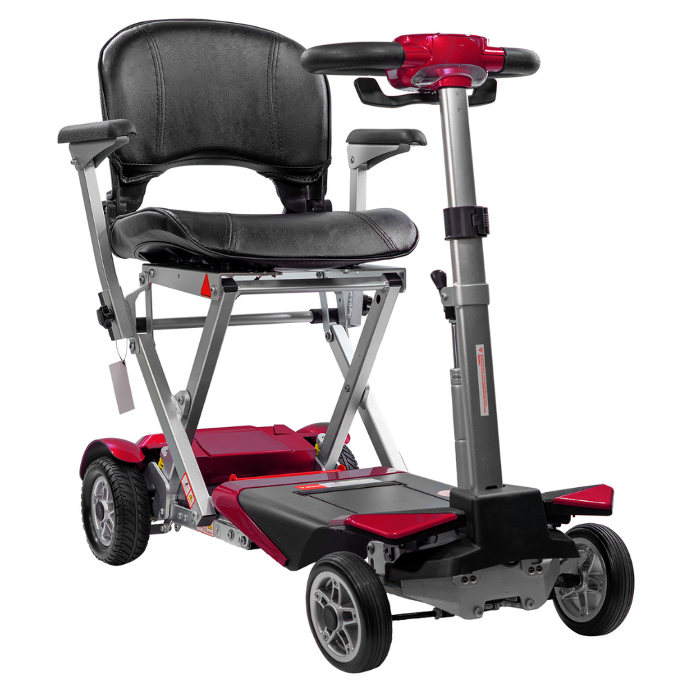 Red scooter from the front right side, with the padded seat and armrests