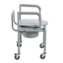 Side view showing the padded armrests, closed lid and locking casters
