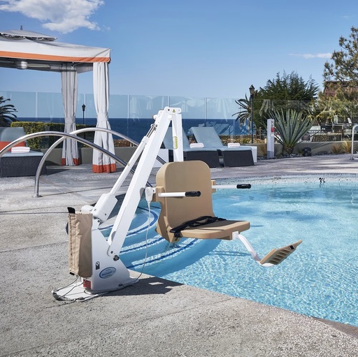 Ranger 2 pool lift with a tan seat lowered into a resort pool