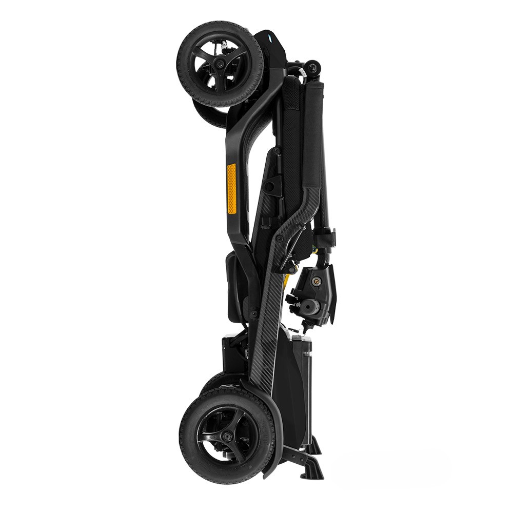 Black scooter folded flat and standing on its kickstands, seat and tiller collapsed