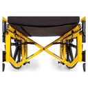 Close-up under the seat: the cross brace tubes meeting at the centre pivot below the black seat sling