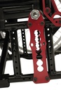 Red rear axle plate with its row of height holes, bolted to the black side frame