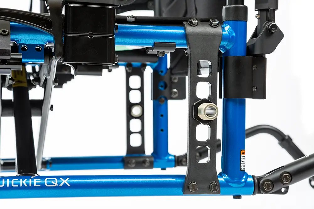 Fixed rear axle plate of the Quickie QX, with holes that set the rear seat height in 1-inch steps