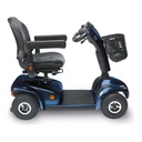 Side view of the Leo in Onyx Blue: flat deck, 10 inch air-filled tires and the angled tiller with basket