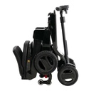 Side view of the Go-Go Carbon folded, with the seat back down and the small wheels it rolls on