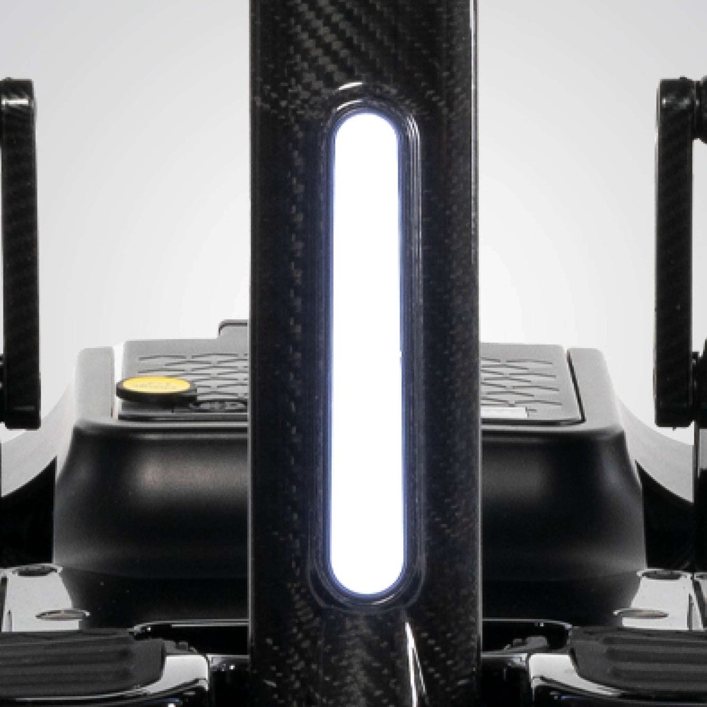 White LED light bar lit on the carbon fibre tiller, above the footrest