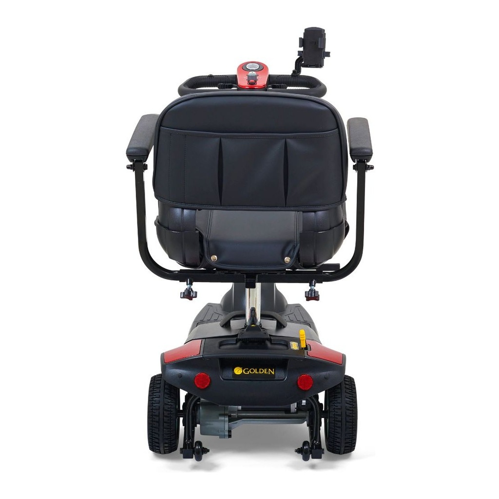 Rear view of the three-wheel scooter showing the seat back, both rear wheels and anti-tip wheels