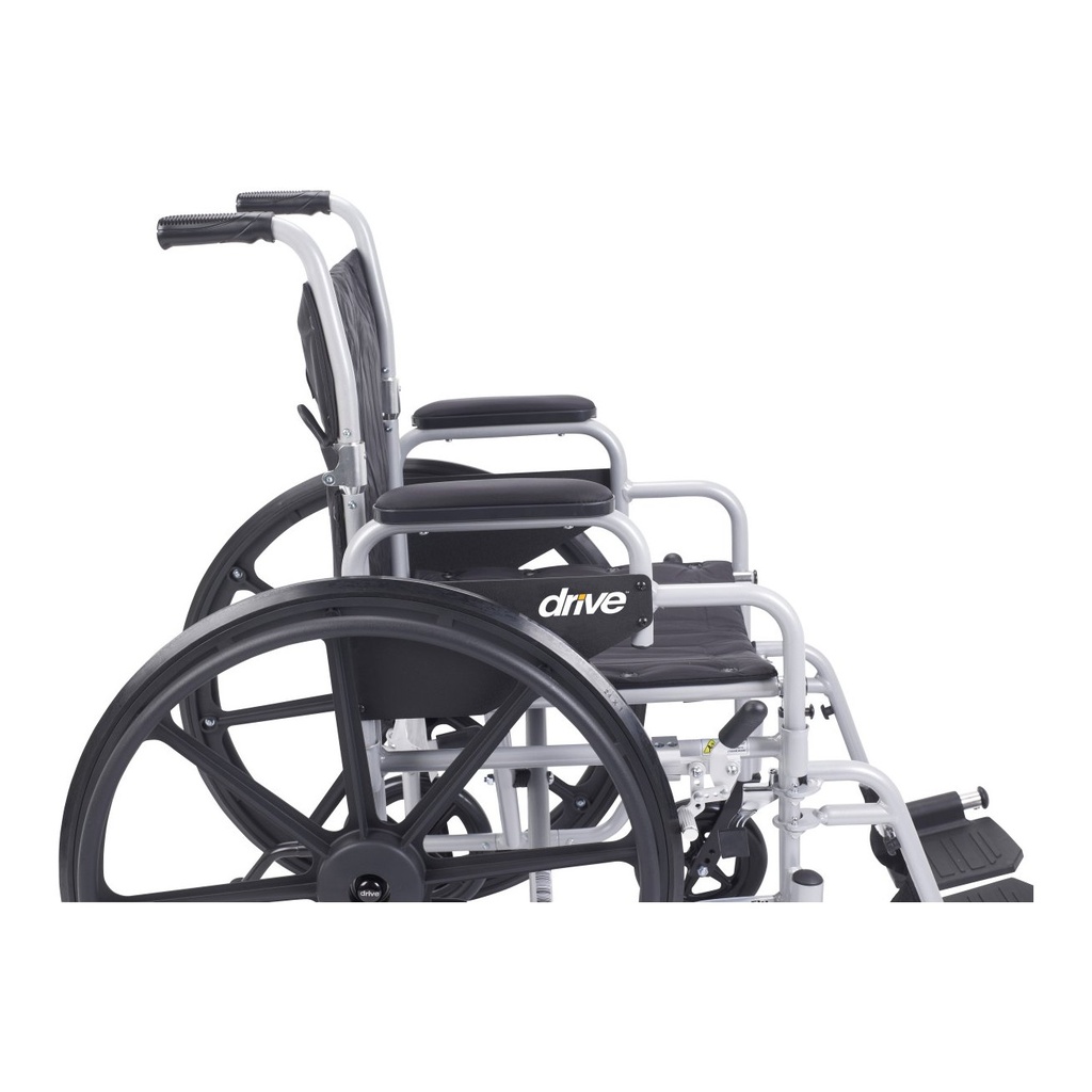 Side view with both padded desk-length armrests in place and the hand rim on the 24 inch wheel
