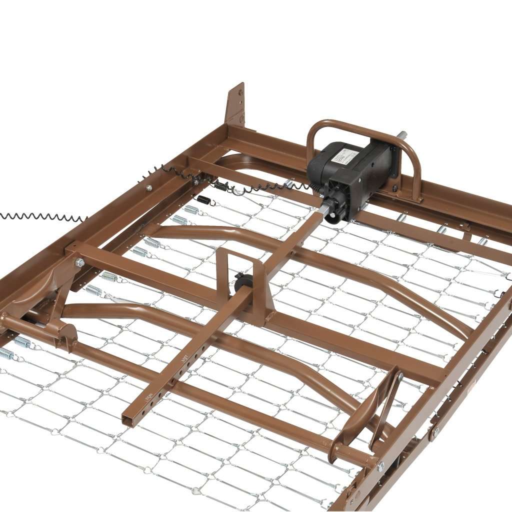 Close-up of the motor and wire spring deck under an example hospital bed