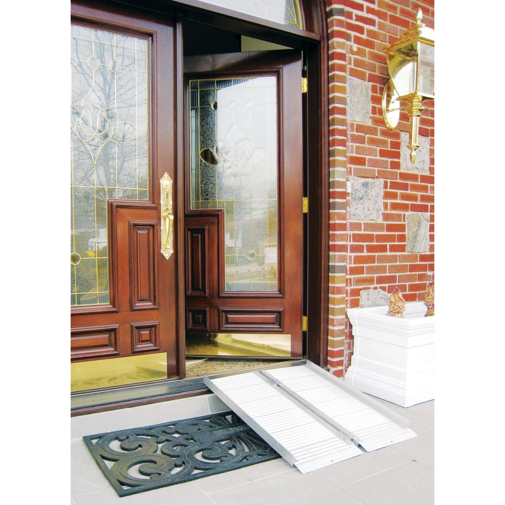 Single-fold ramp set up at a front door, showing the perforated deck and its top lip