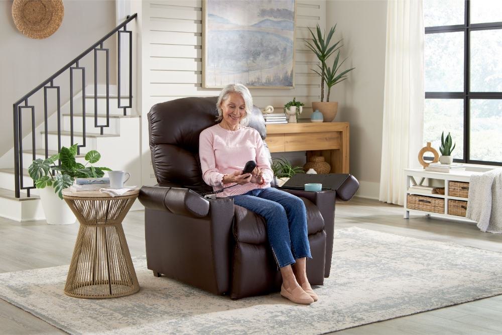 Cloud Plus PR511 in a living room, sitter upright holding the hand control