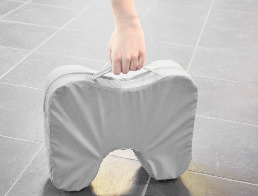 The covered FootStool 8090 carried by its handle on a tiled floor