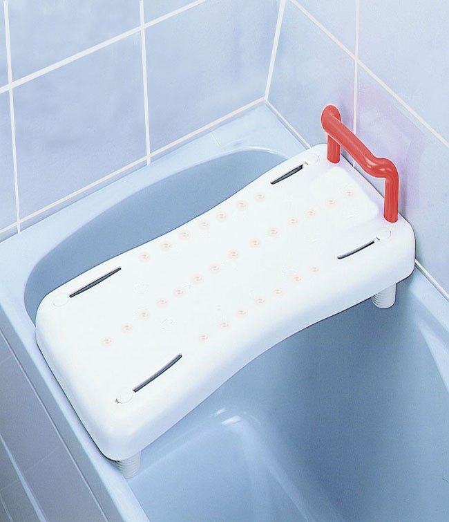 The same MOBB board lying across a blue tub in a tiled bathroom, its handle upright and its feet on the tub edges