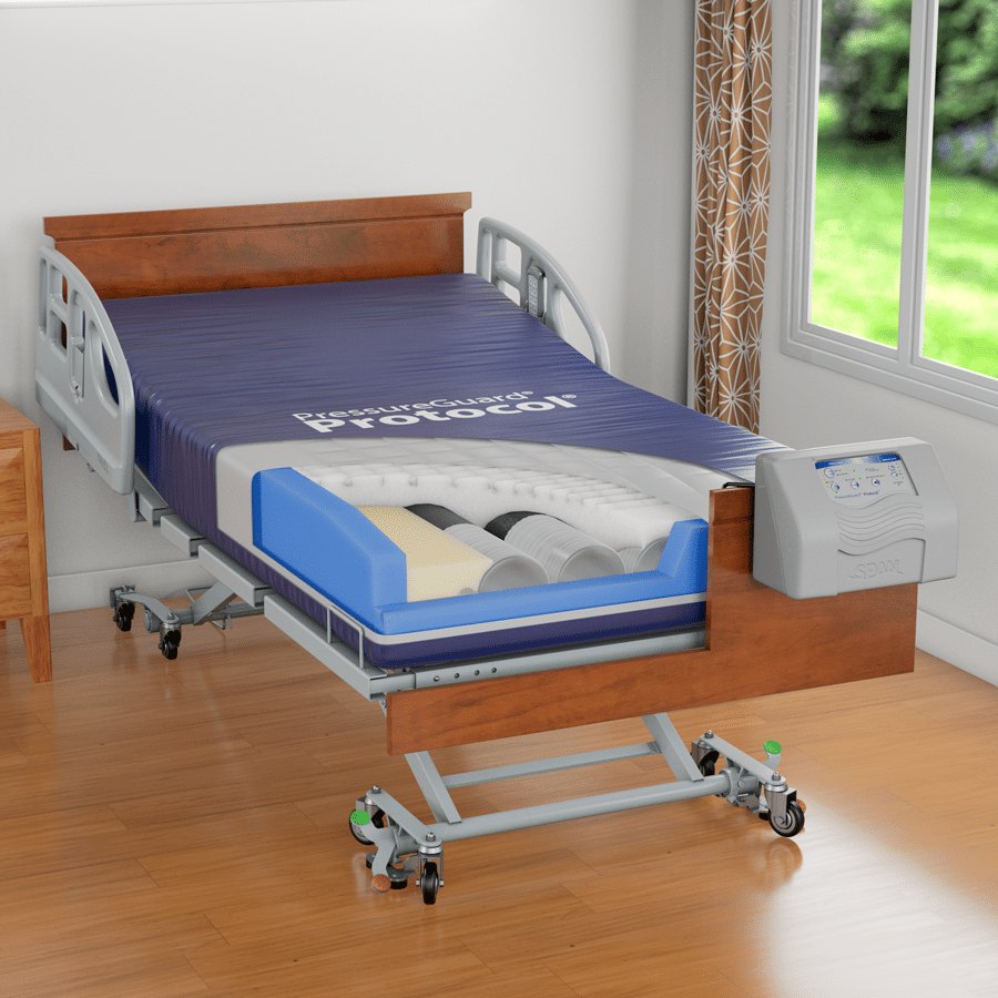 PressureGuard Protocol mattress on a wood bed with the control unit beside it