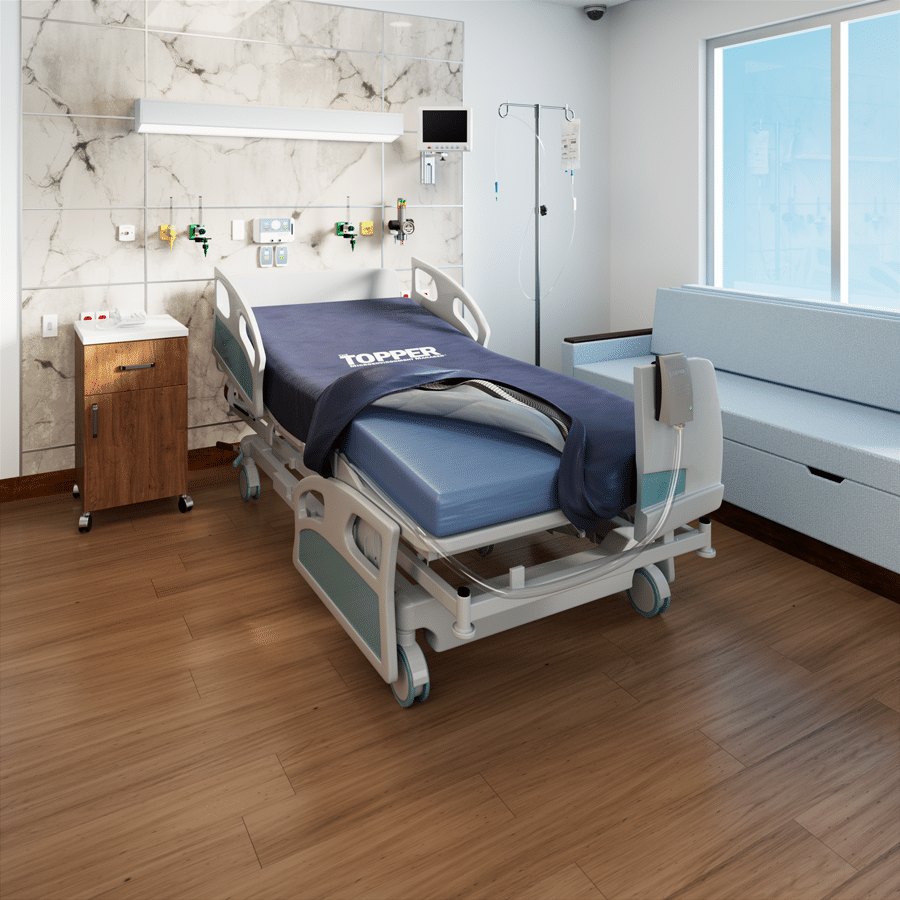 Navy Topper coverlet on a hospital bed in a patient room