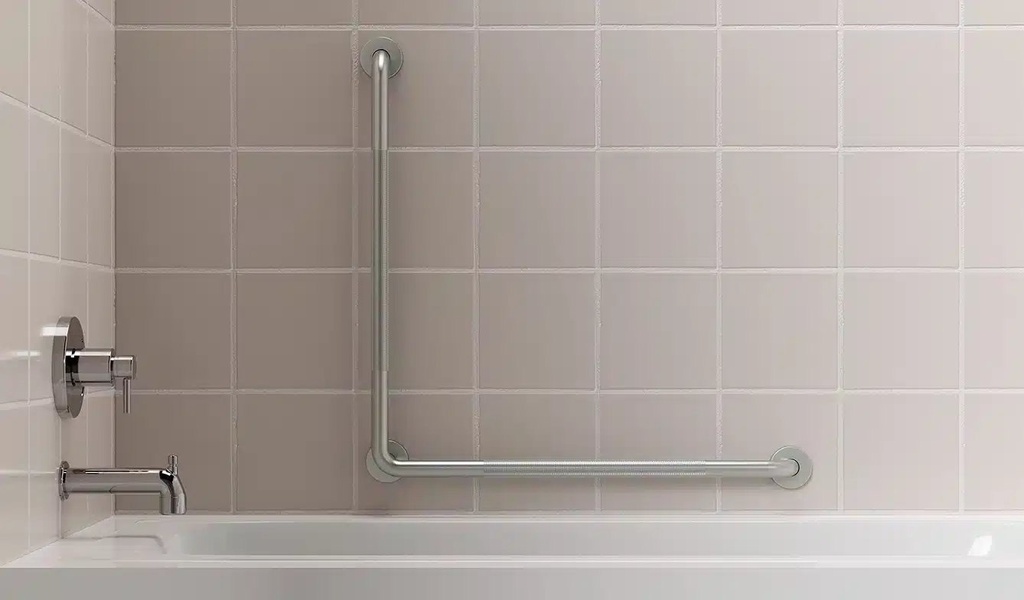 The HealthCraft L-shaped grab bar fitted on tiled wall beside a bathtub