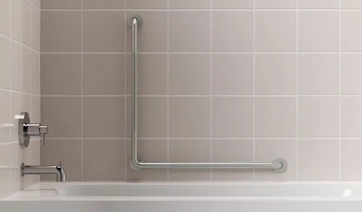 The HealthCraft L-shaped grab bar fitted on tiled wall beside a bathtub