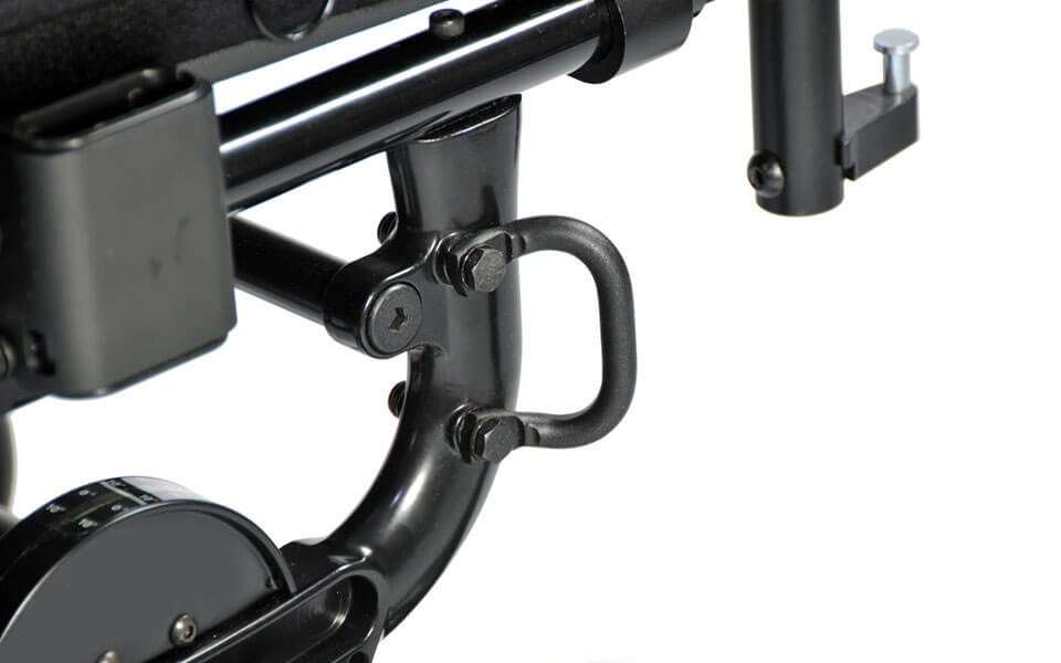 Close-up of a D-shaped transit tie-down loop bolted to the frame, with the tilt indicator dial below