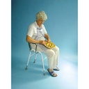 A person seated on the Parsons perching stool while working at a counter