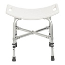 The back edge of the shower chair seat, with a hand hold cut into each side