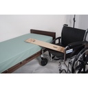 A wider view of the board reaching from the wheelchair to the bed