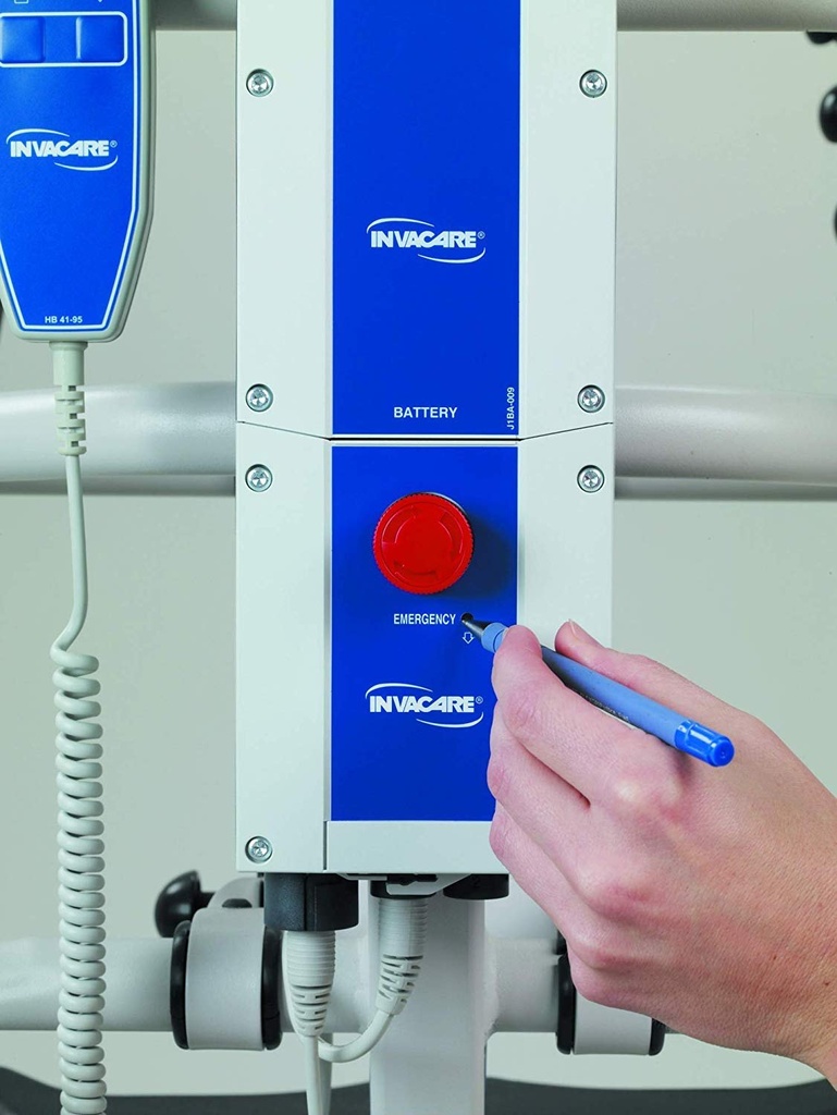Hand using a pen in the emergency hole on the blue Invacare control box