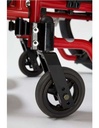 Front caster and fork below the caster housing of a red frame