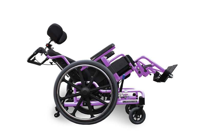 Lavender STP frame, painted to order, tilted back with a headrest in place and the footplates out front