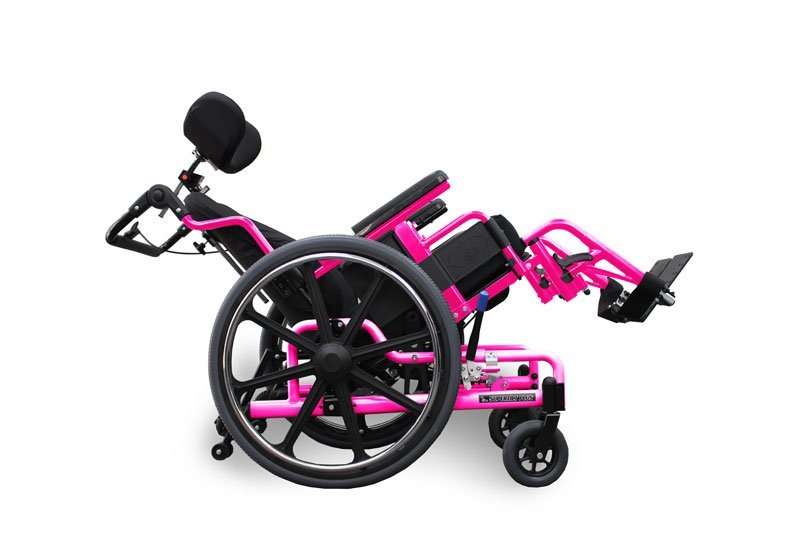 Pink custom-colour STP seen side on, the seat, back and legrests rotated back as one unit