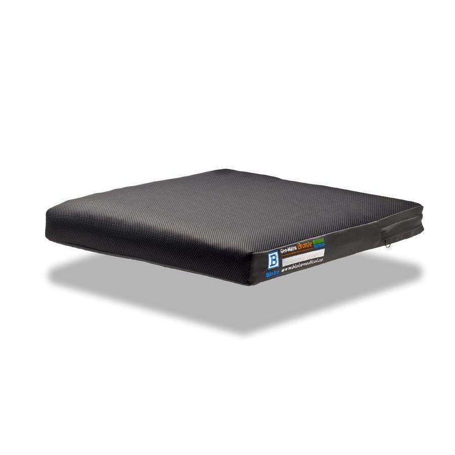 Bronze cushion in a charcoal mesh-top outer cover, side three-quarter view on white