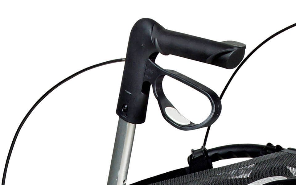 Black push handle and brake lever on a silver support tube