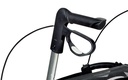 Black push handle and brake lever on a silver support tube