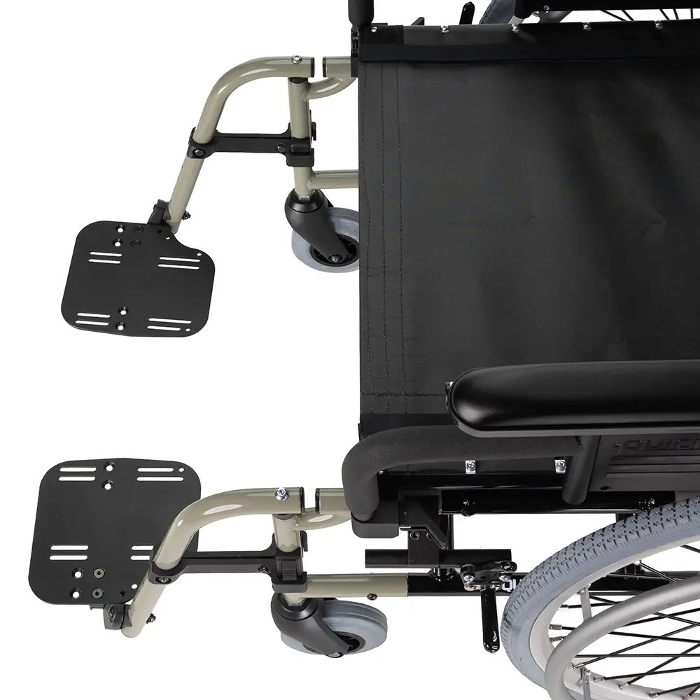 Footplate and front hanger detail on a Quickie M6 wheelchair, with a caster and the armrest