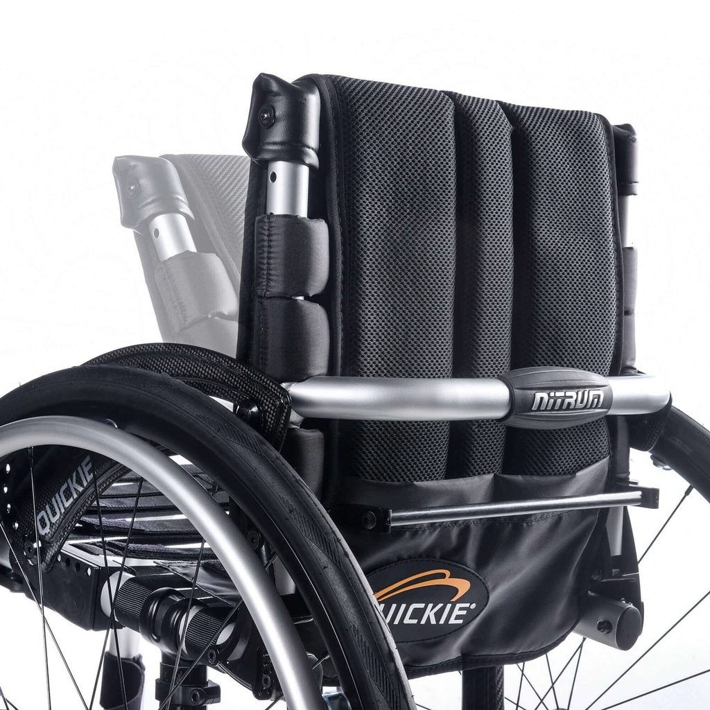 The folding back of a Quickie Nitrum wheelchair, showing the release bar and Quickie logo