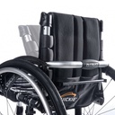 The folding back of a Quickie Nitrum wheelchair, showing the release bar and Quickie logo