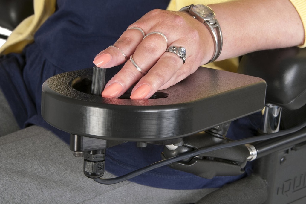 A hand resting on the BulletTray with the MicroGuide joystick under the fingers