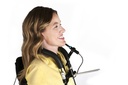 A rider driving a power chair with the MicroGuide chin boom at the chin