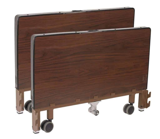Wood grain head and foot ends of the Delta low bed, each standing on two casters