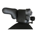 The head array on its headrest, with the lateral pads in place and a mode switch on the arm