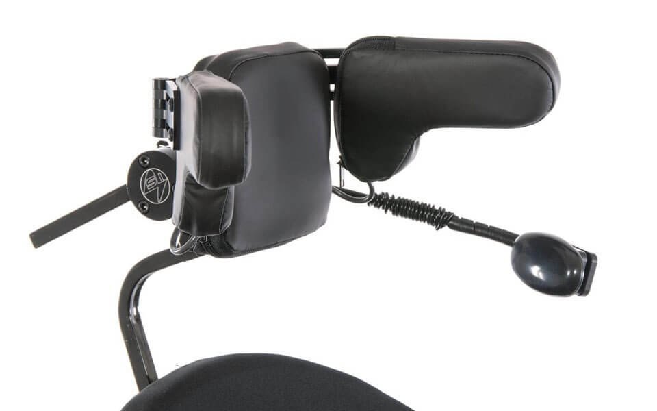 The head array's mode switch on its coiled rod, beside the back pad