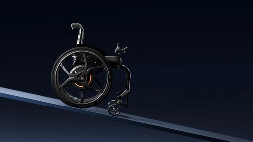 Empulse M90 powered rear wheel on a rigid chair, climbing a slope
